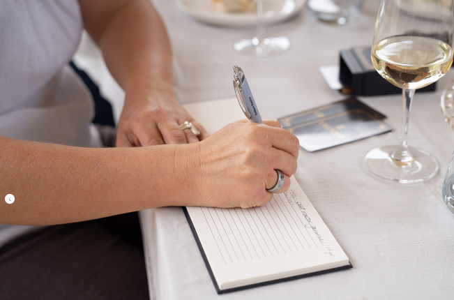 writing a note in the journal